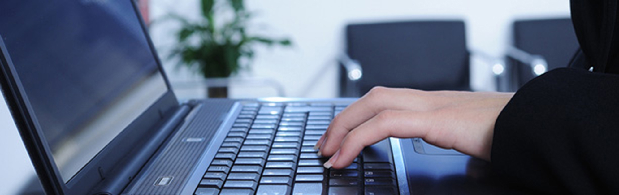 Close-up of a laptop being used at a desk
